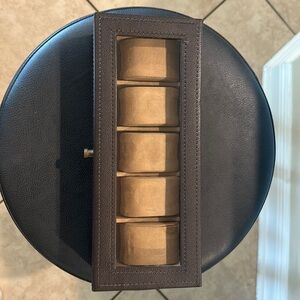 Brown leather Pottery Barn watch case.